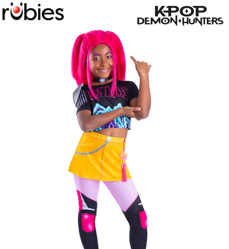 K-Pop Demon Hunters Mia kids costume – yellow skirt, printed crop top and leggings inspired by the Netflix animated movie.

Kids Mia K-Pop Demon Hunters costume featuring yellow skirt, printed top, attached leggings and pink charm accessory.

Mia K-Pop Demon Hunters costume crop top close-up with digital print and short sleeves.

Yellow skirt with attached printed leggings from Mia K-Pop Demon Hunters kids costume.

Mia K-Pop Demon Hunters costume accessories including felt neckpiece with printed gem and pi