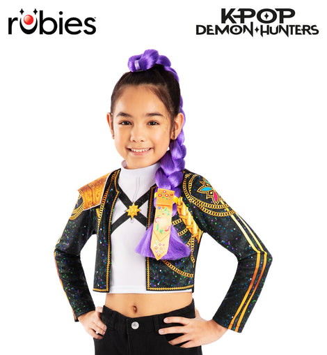 Child model wearing a colorful KPOP outfit with a Rubies costume label. 