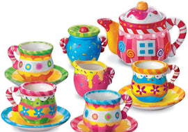 Colorful children's tea set with teapot, cups, and saucers on a white background