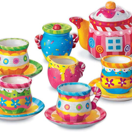 Colorful children's tea set with teapot, cups, and saucers on a white background
